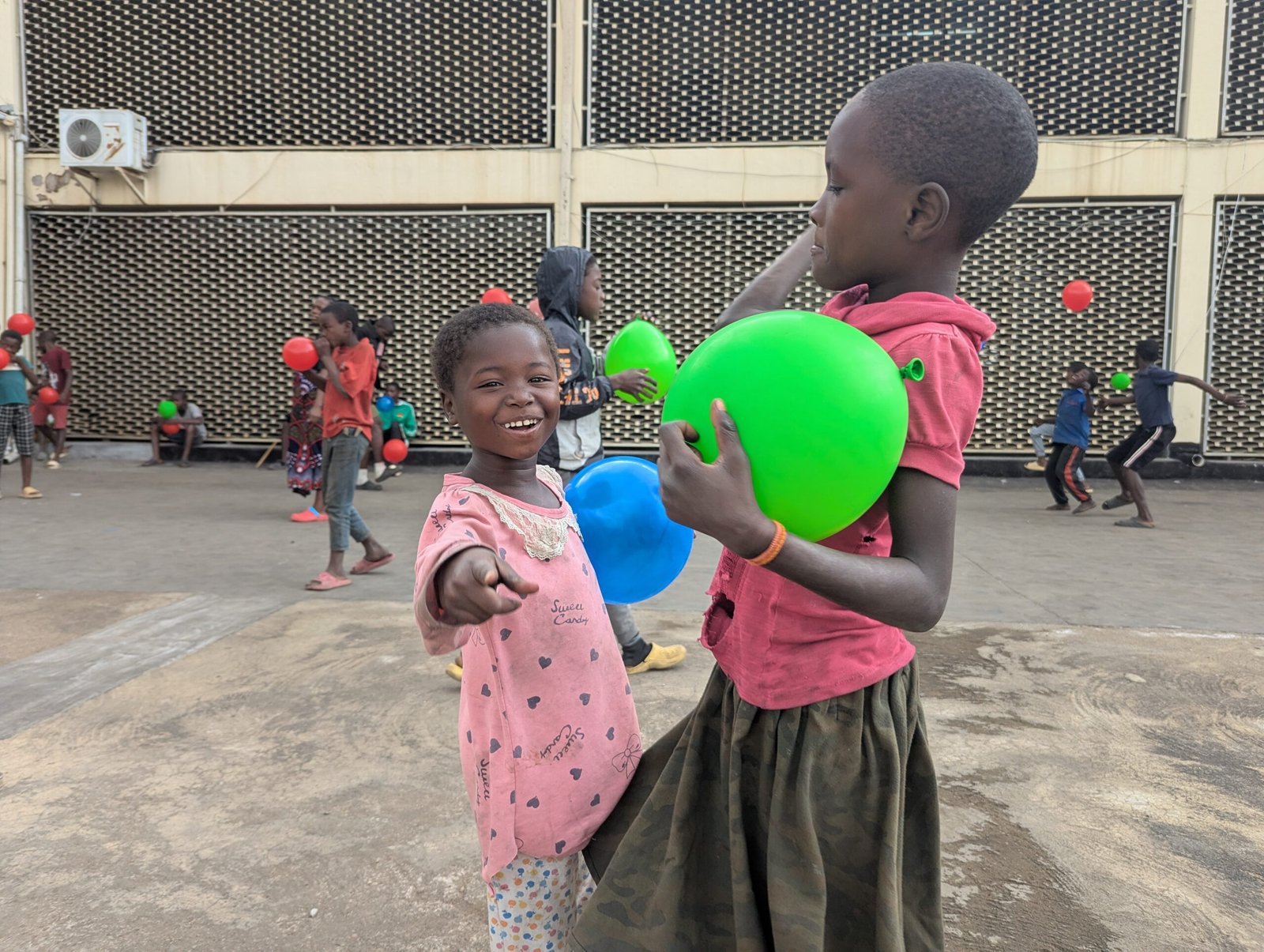 Street connected children in Blantyre, Malawi playing with balloons at life skills session